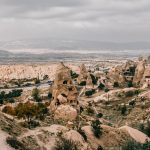 From above of picturesque view of ancient rough carved stone buildings in Cappadocia