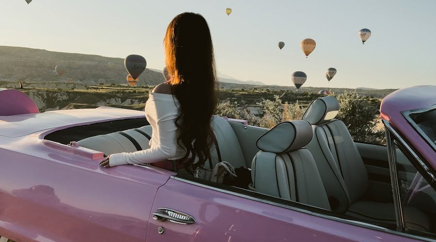 Woman Sitting in Pink Cabriolet in Cappadocia